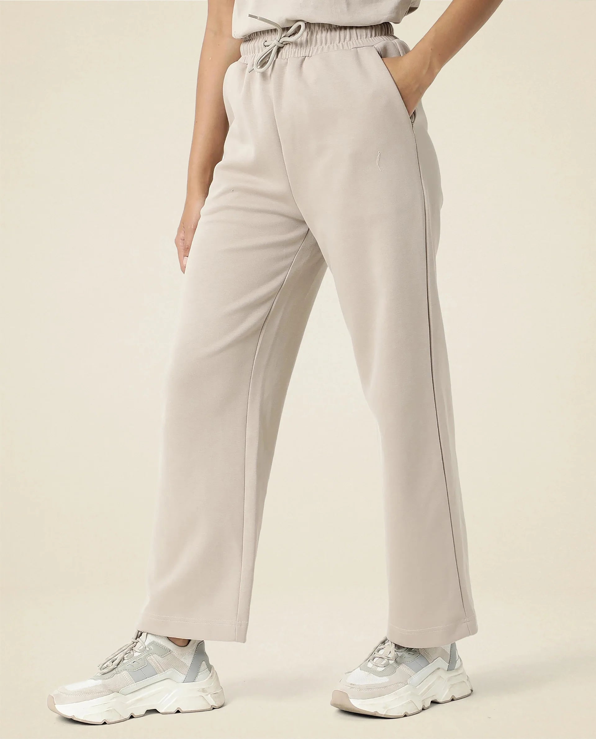 Rareism Women Capsule Beige Cotton Blend Fabric Relaxed Fit Solid Mid Rise Ankle Length Track Pant