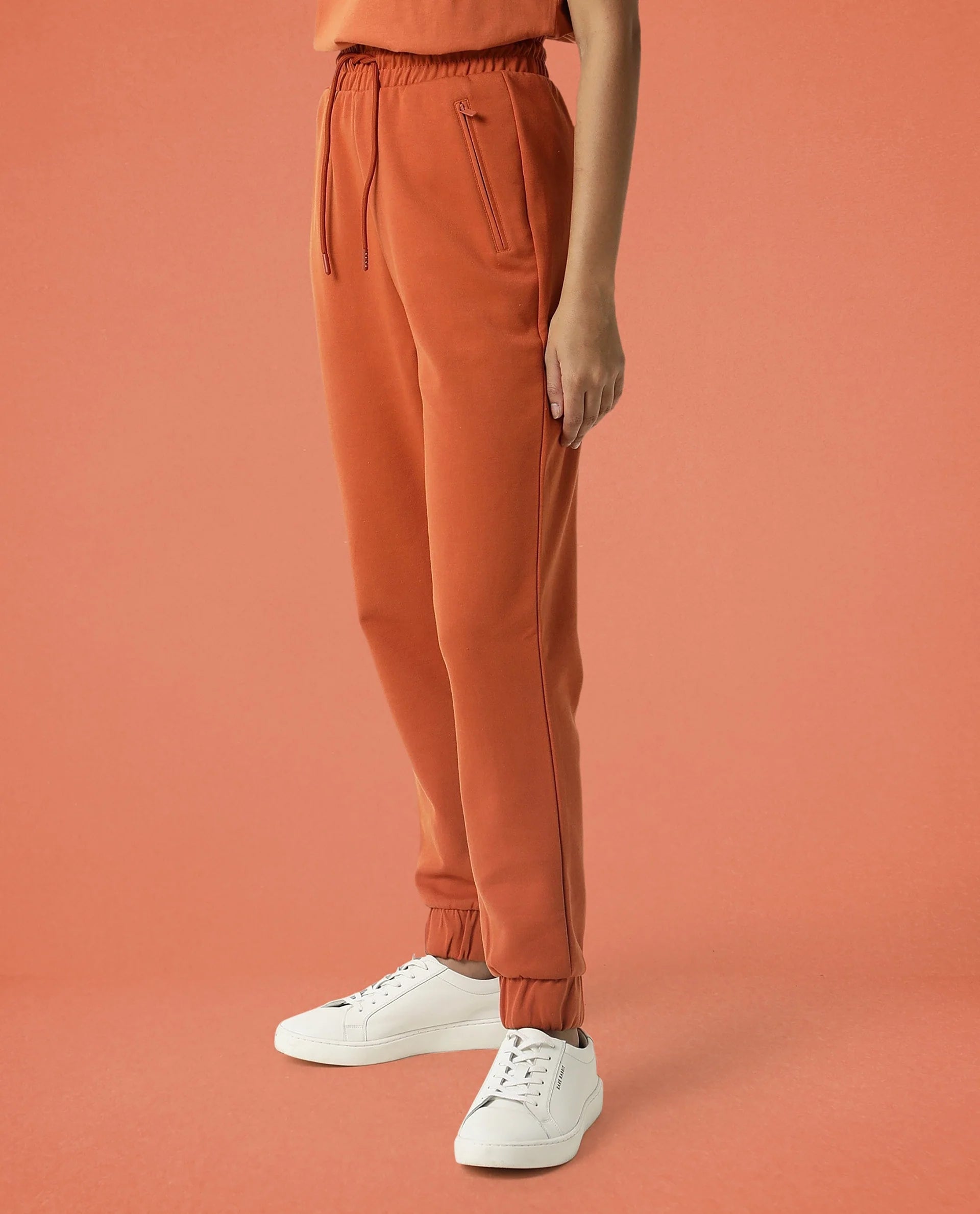 Rareism Women Creta Orange Cotton Blend Fabric Relaxed Fit Solid Mid Rise Ankle Length Track Pant