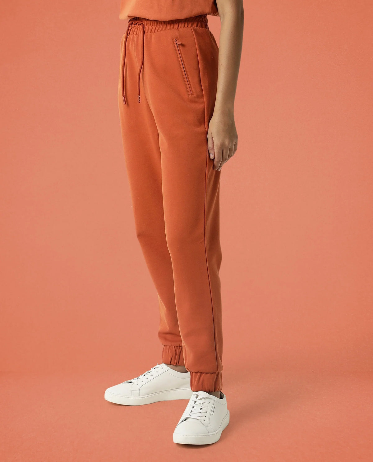 Rareism Women Creta Orange Cotton Blend Fabric Relaxed Fit Solid Mid Rise Ankle Length Track Pant