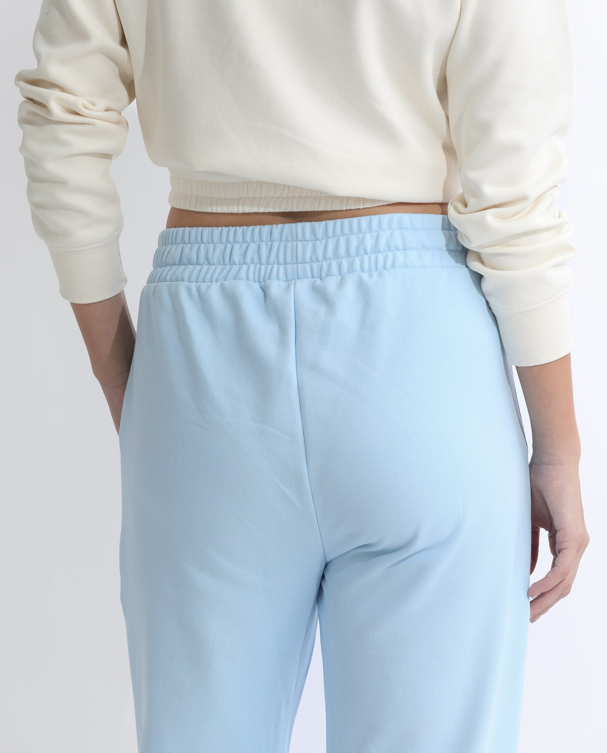 Rareism Women Fronk Light Blue Poly Cotton Fabric Tailored Fit Solid Mid Rise Ankle Length Track Pant