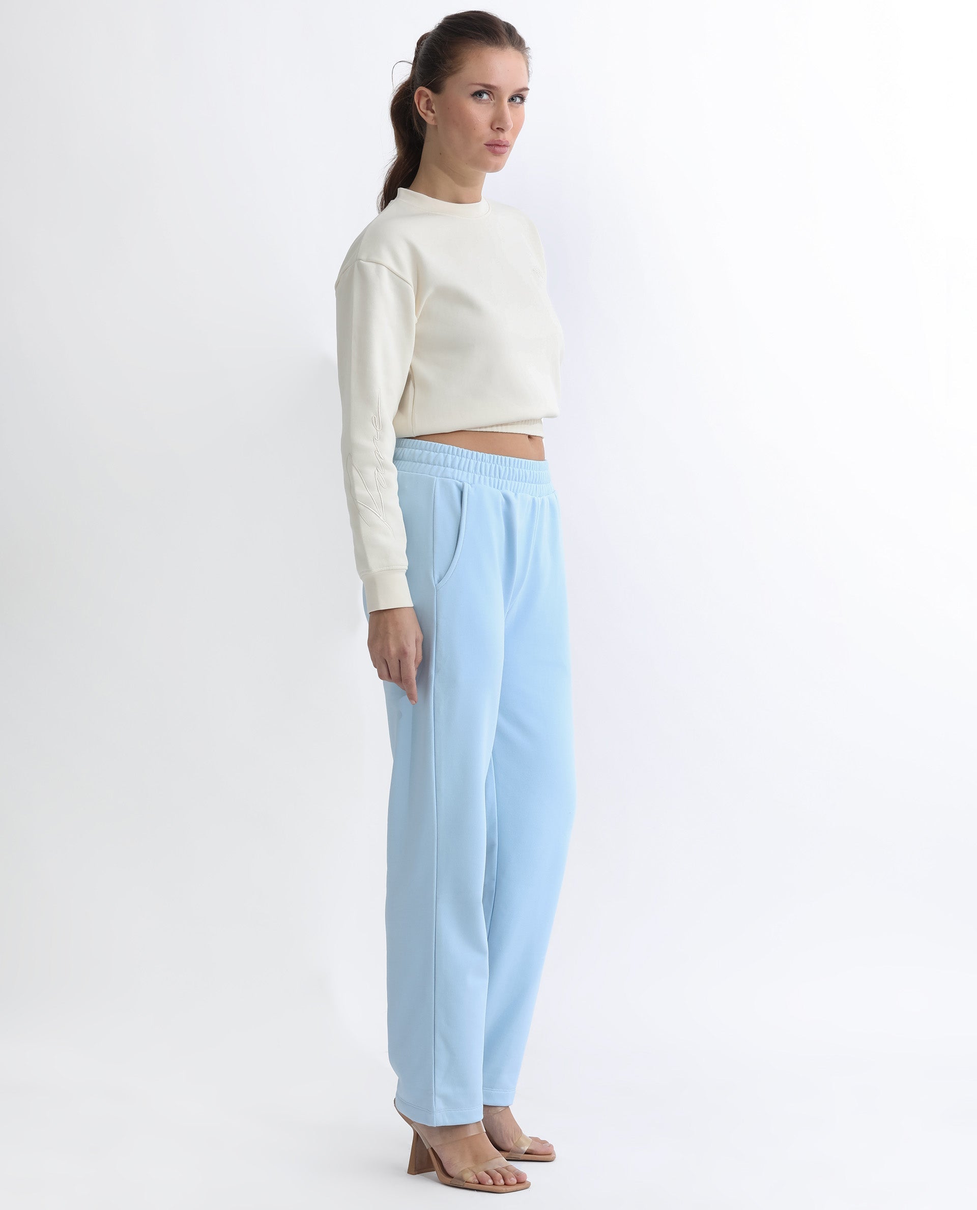 Rareism Women Fronk Light Blue Poly Cotton Fabric Tailored Fit Solid Mid Rise Ankle Length Track Pant
