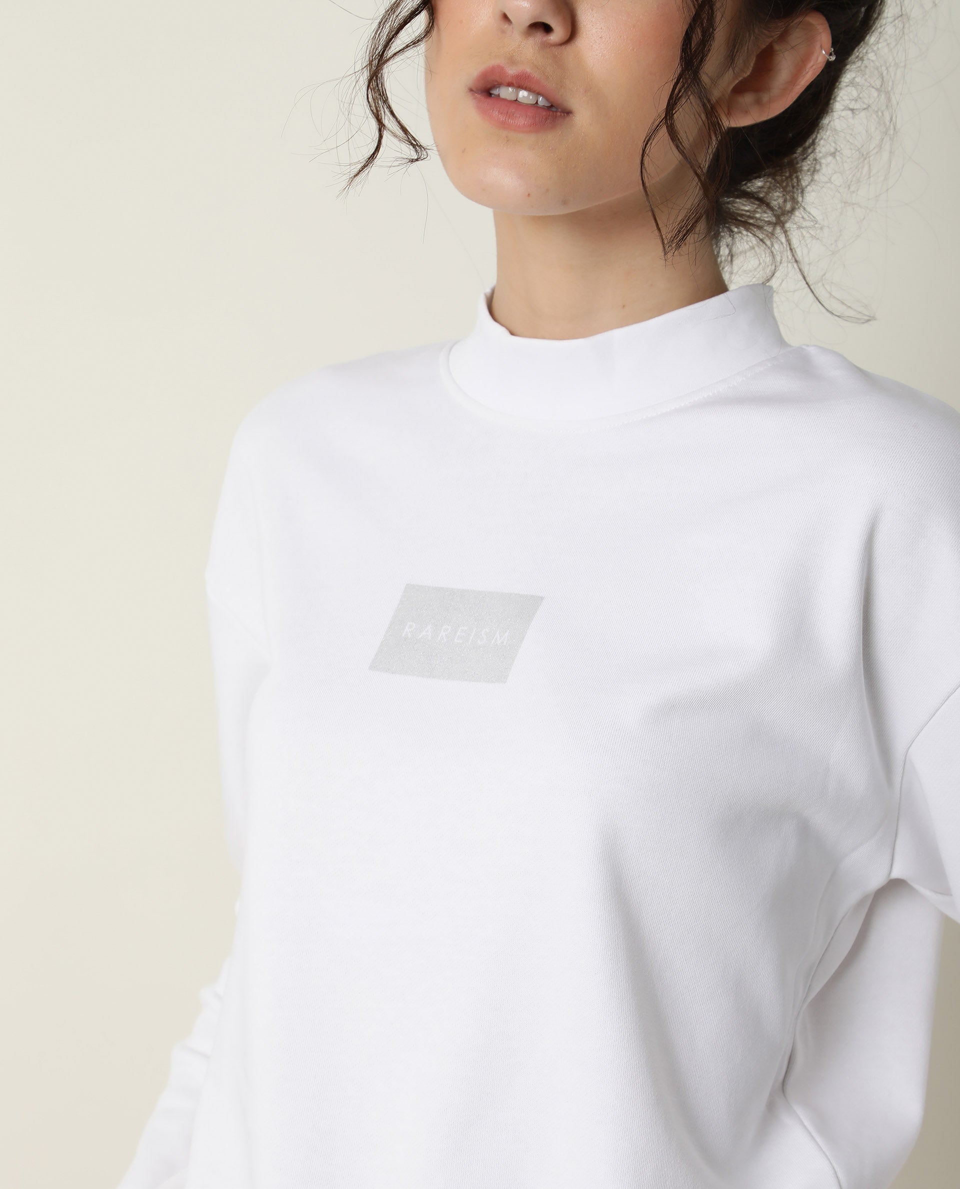 Rareism Women Hectare White Cotton Poly Fabric Relaxed Fit Full Sleeves Solid High Neck Sweatshirt