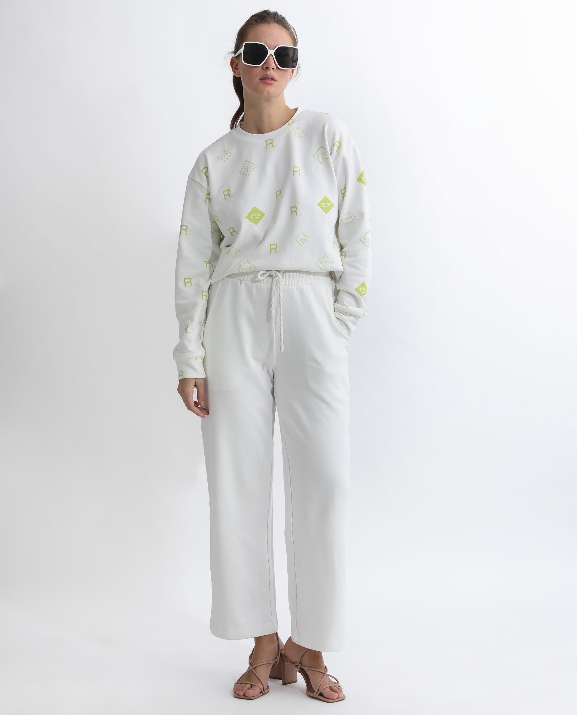 Rareism Women Pazoo T Off White Cotton Blend Fabric Flared Solid Mid Rise Ankle Length Track Pant