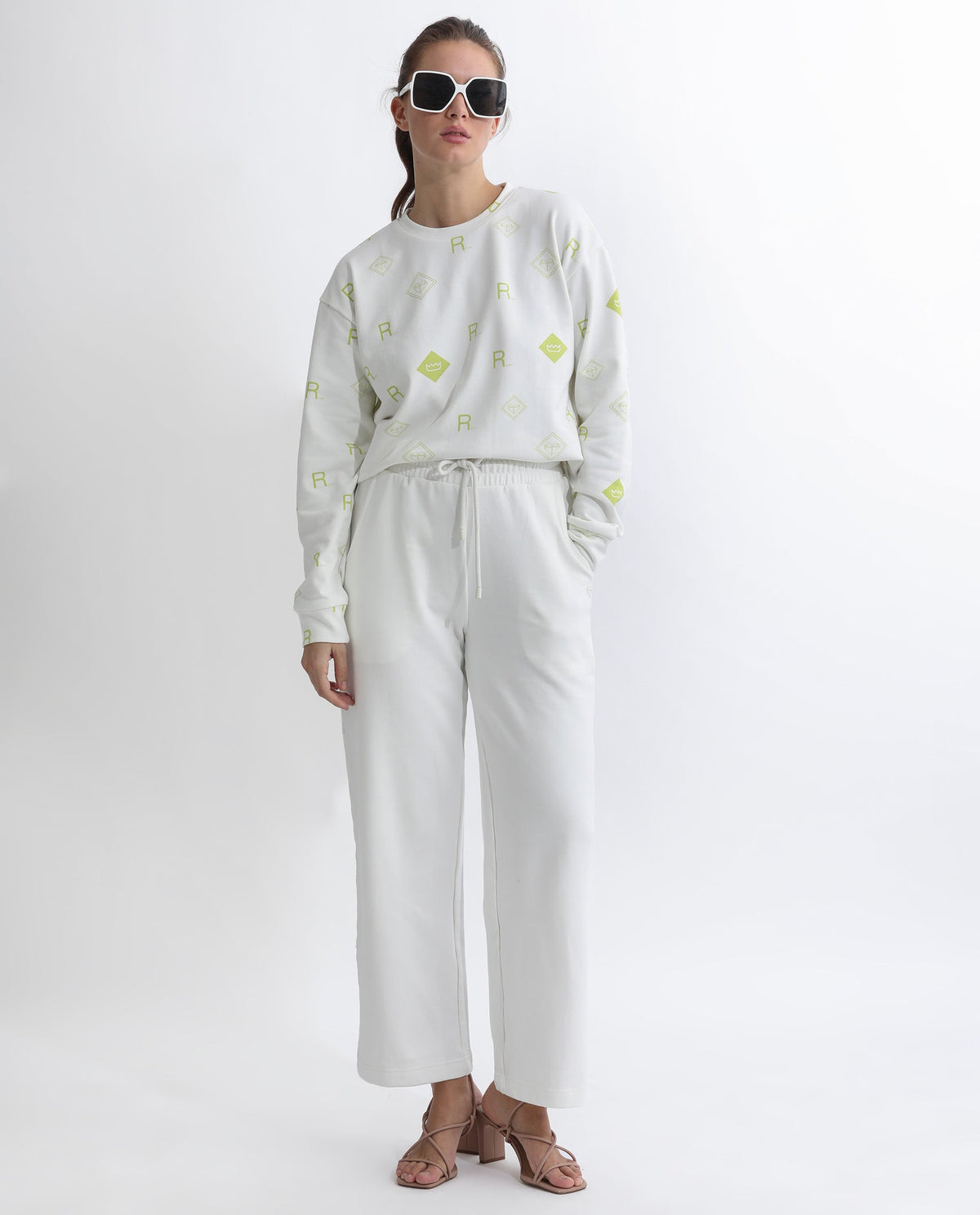 Rareism Women Pazoo T Off White Cotton Blend Fabric Flared Solid Mid Rise Ankle Length Track Pant