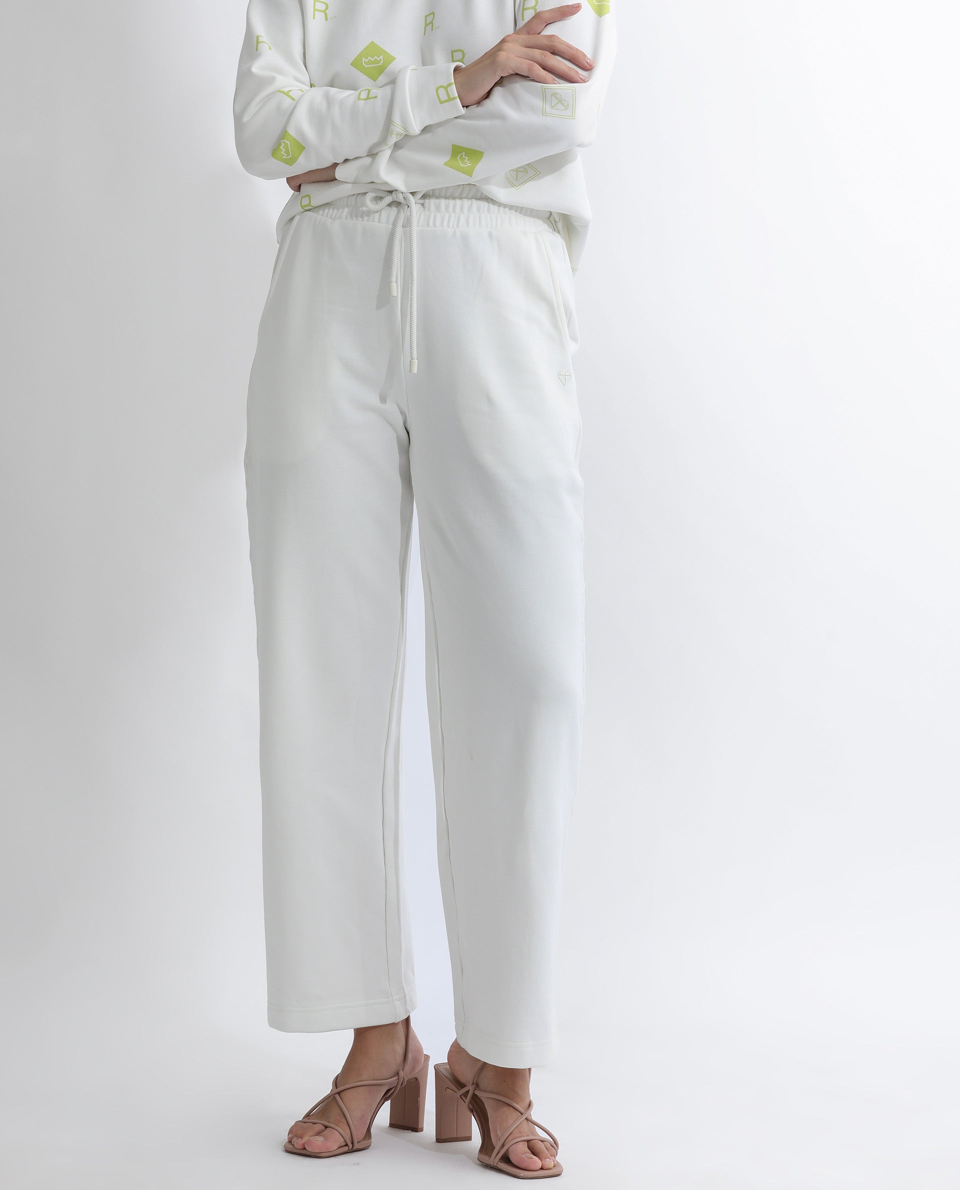 Rareism Women Pazoo T Off White Cotton Blend Fabric Flared Solid Mid Rise Ankle Length Track Pant