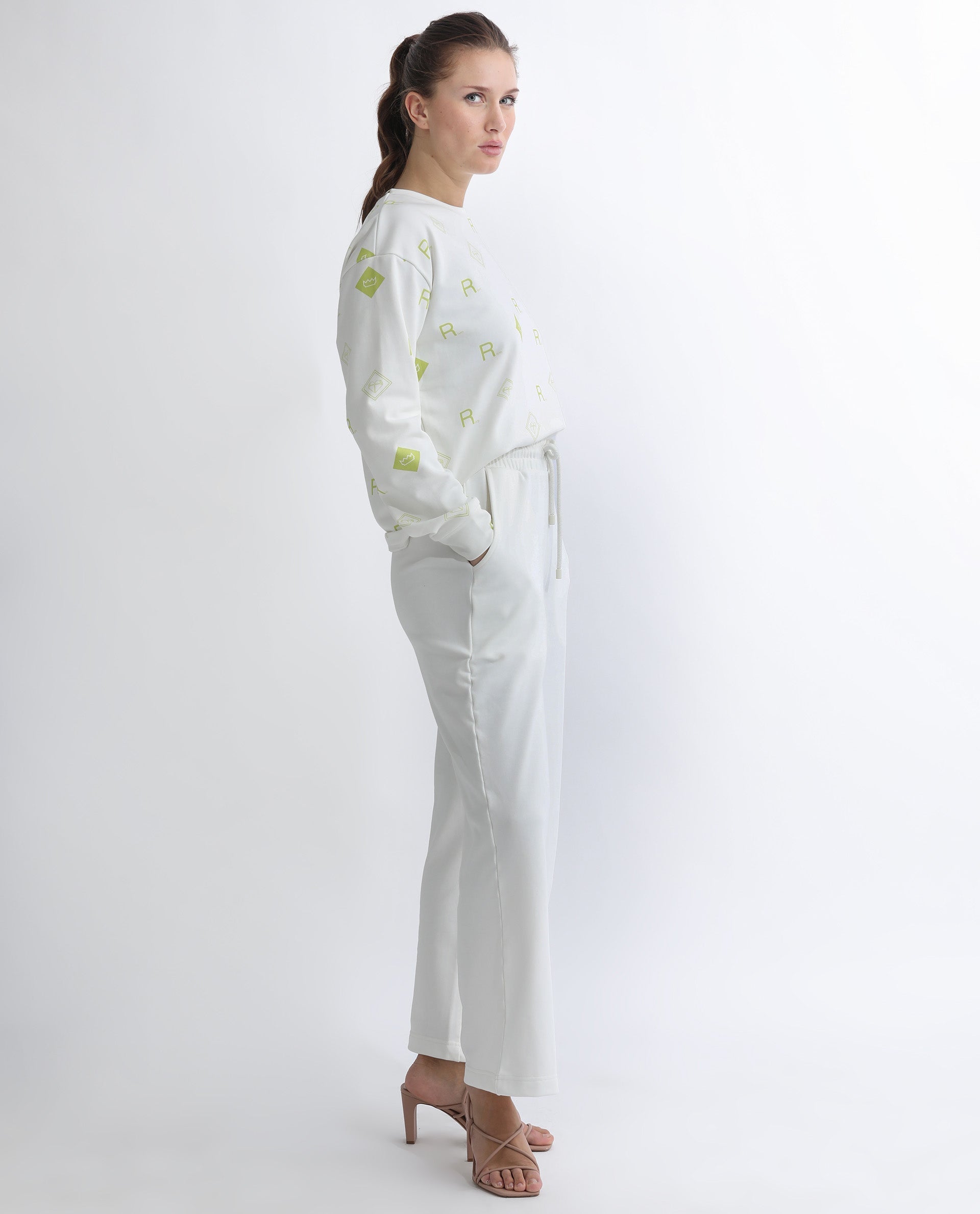 Rareism Women Pazoo T Off White Cotton Blend Fabric Flared Solid Mid Rise Ankle Length Track Pant