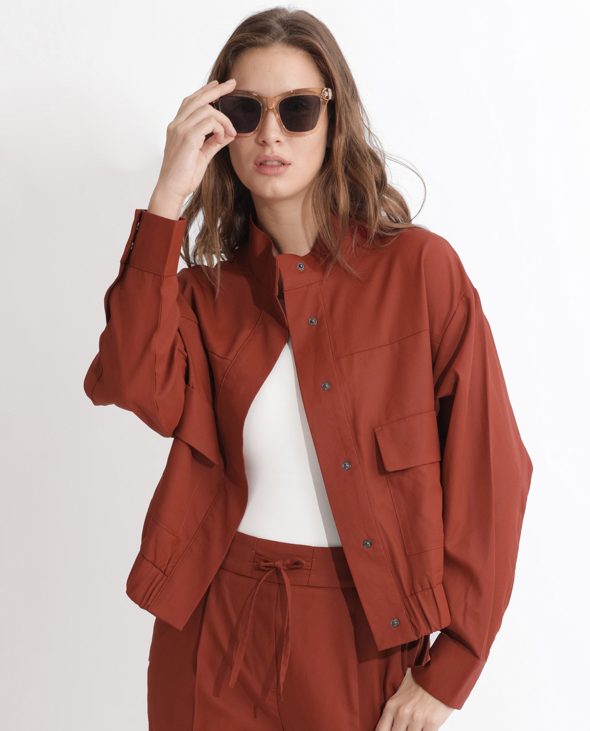 Rareism Articale Women Ruks Rust Polyester Fabric Full Sleeves Button Closure High Neck Regular Fit Plain Jacket