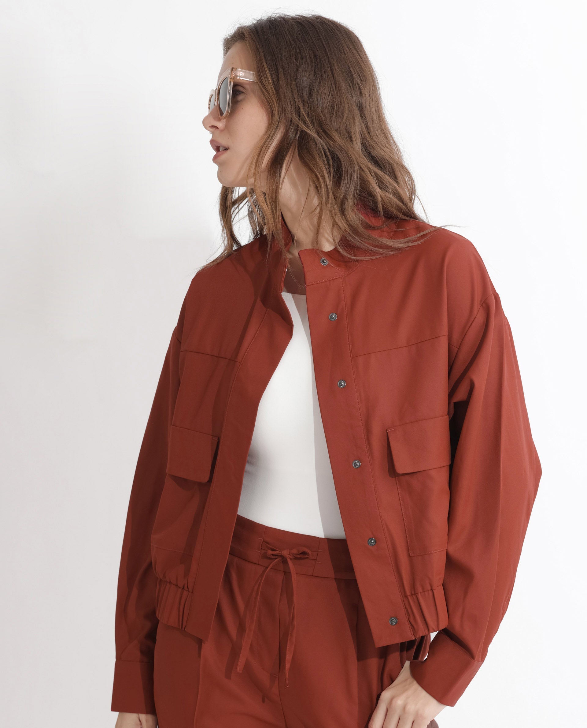 Rareism Articale Women Ruks Rust Polyester Fabric Full Sleeves Button Closure High Neck Regular Fit Plain Jacket