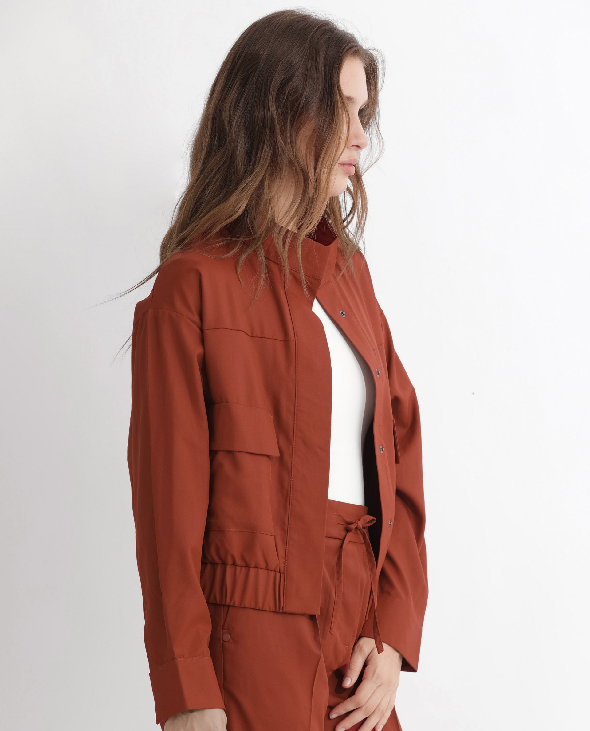 Rareism Articale Women Ruks Rust Polyester Fabric Full Sleeves Button Closure High Neck Regular Fit Plain Jacket