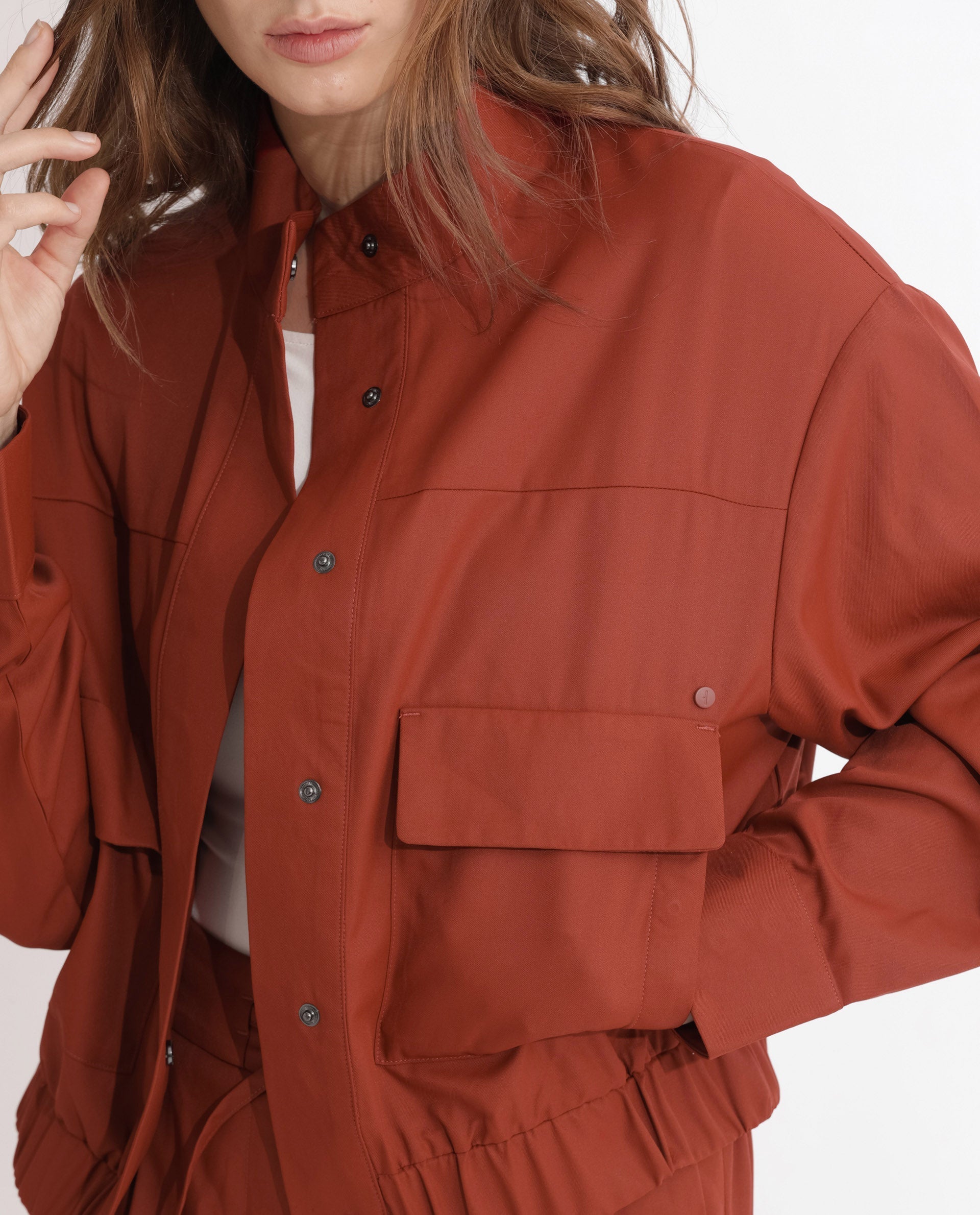Rareism Articale Women Ruks Rust Polyester Fabric Full Sleeves Button Closure High Neck Regular Fit Plain Jacket