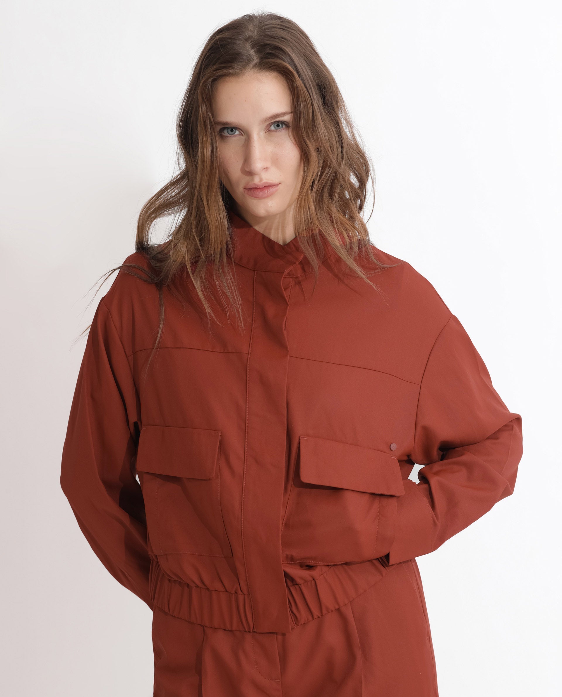Rareism Articale Women Ruks Rust Polyester Fabric Full Sleeves Button Closure High Neck Regular Fit Plain Jacket