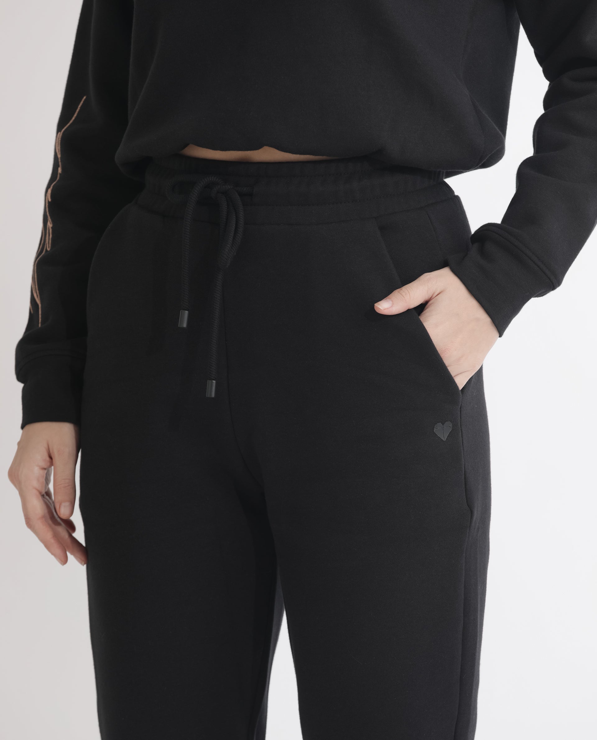 Rareism Women Terac F Black Poly Cotton Fabric Regular Fit Solid Mid Rise Ankle Length Track Pant