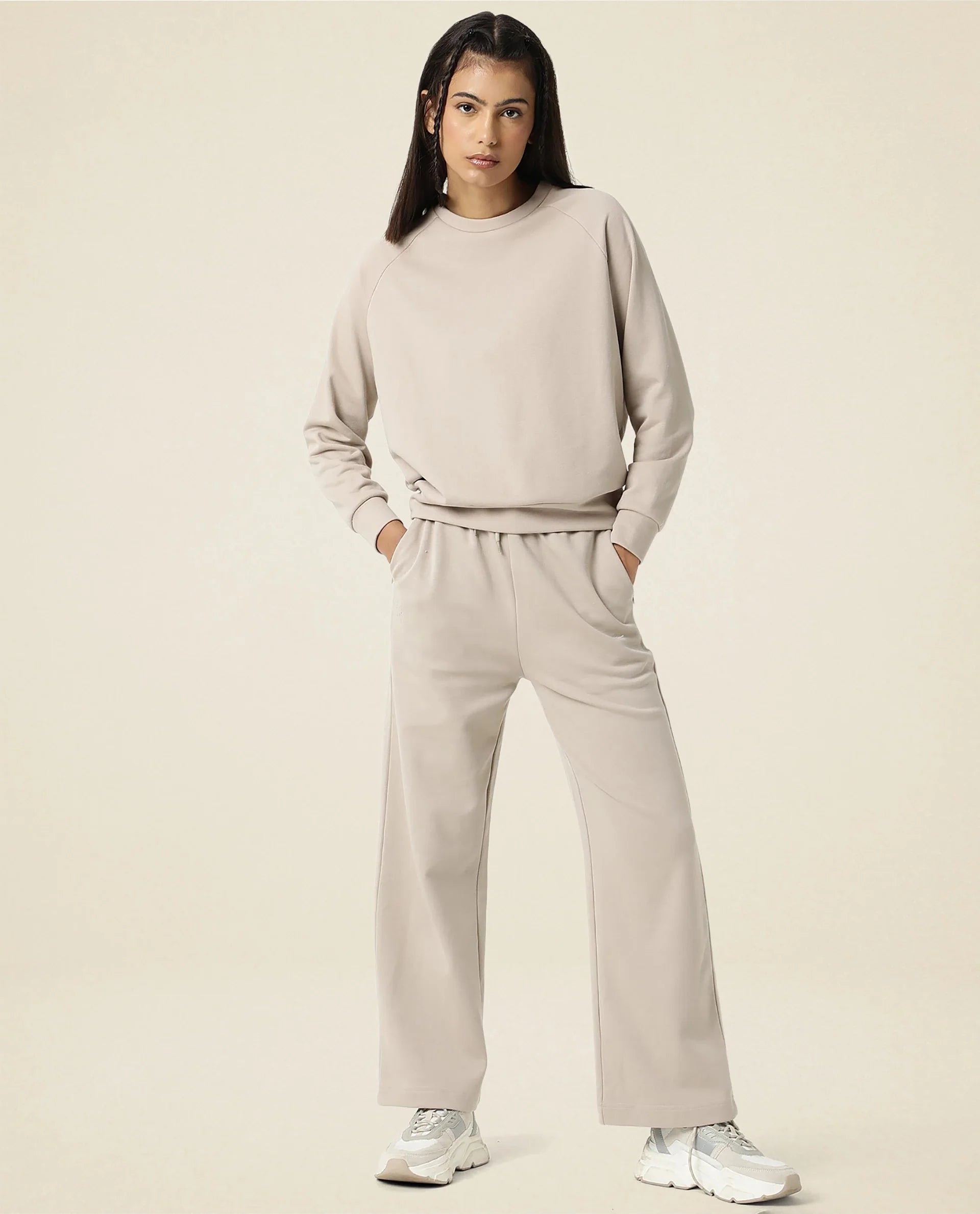 Rareism Women Capsule Beige Cotton Blend Fabric Relaxed Fit Solid Mid Rise Ankle Length Track Pant