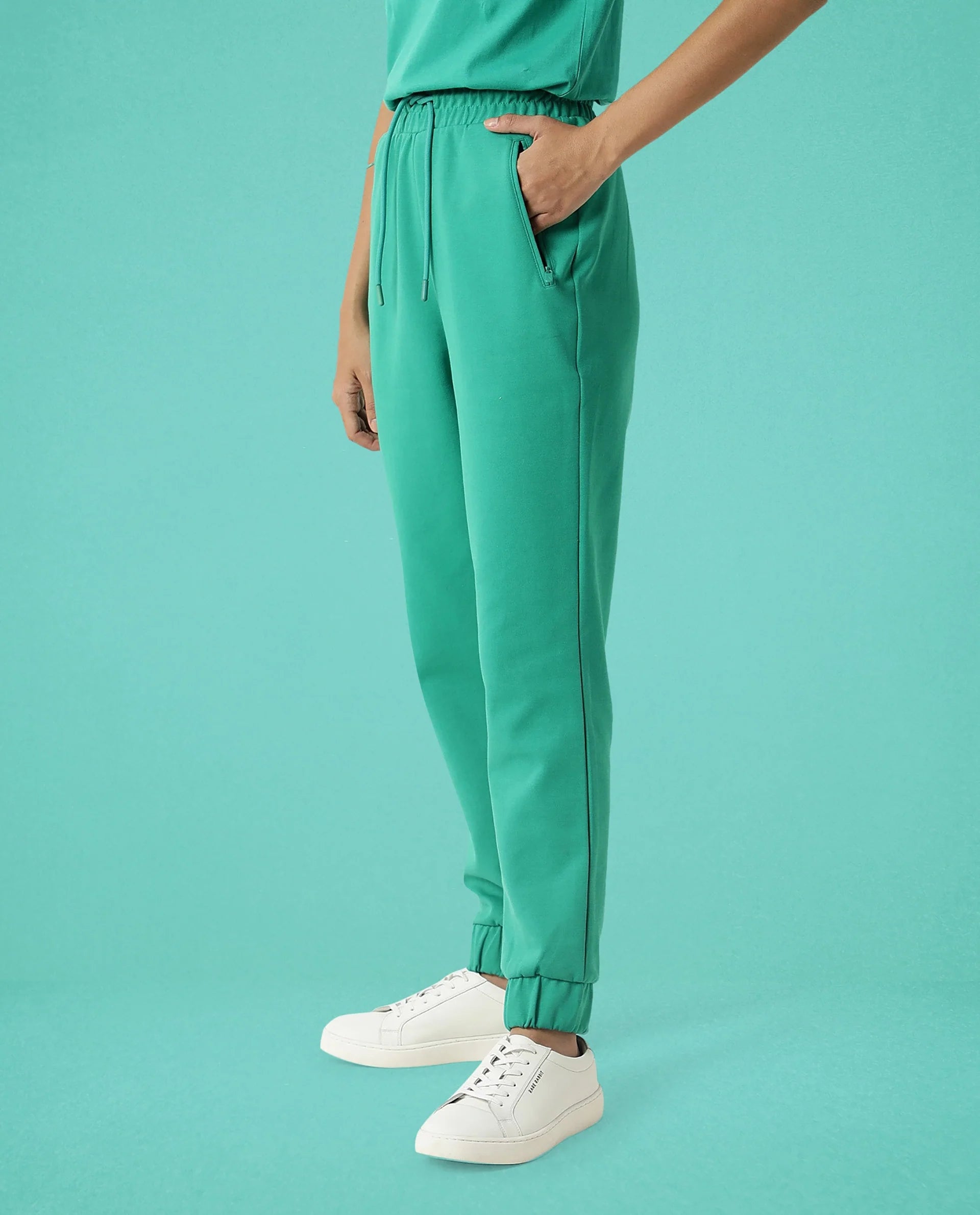 Rareism Women Creta Green Cotton Blend Fabric Relaxed Fit Solid Mid Rise Ankle Length Track Pant