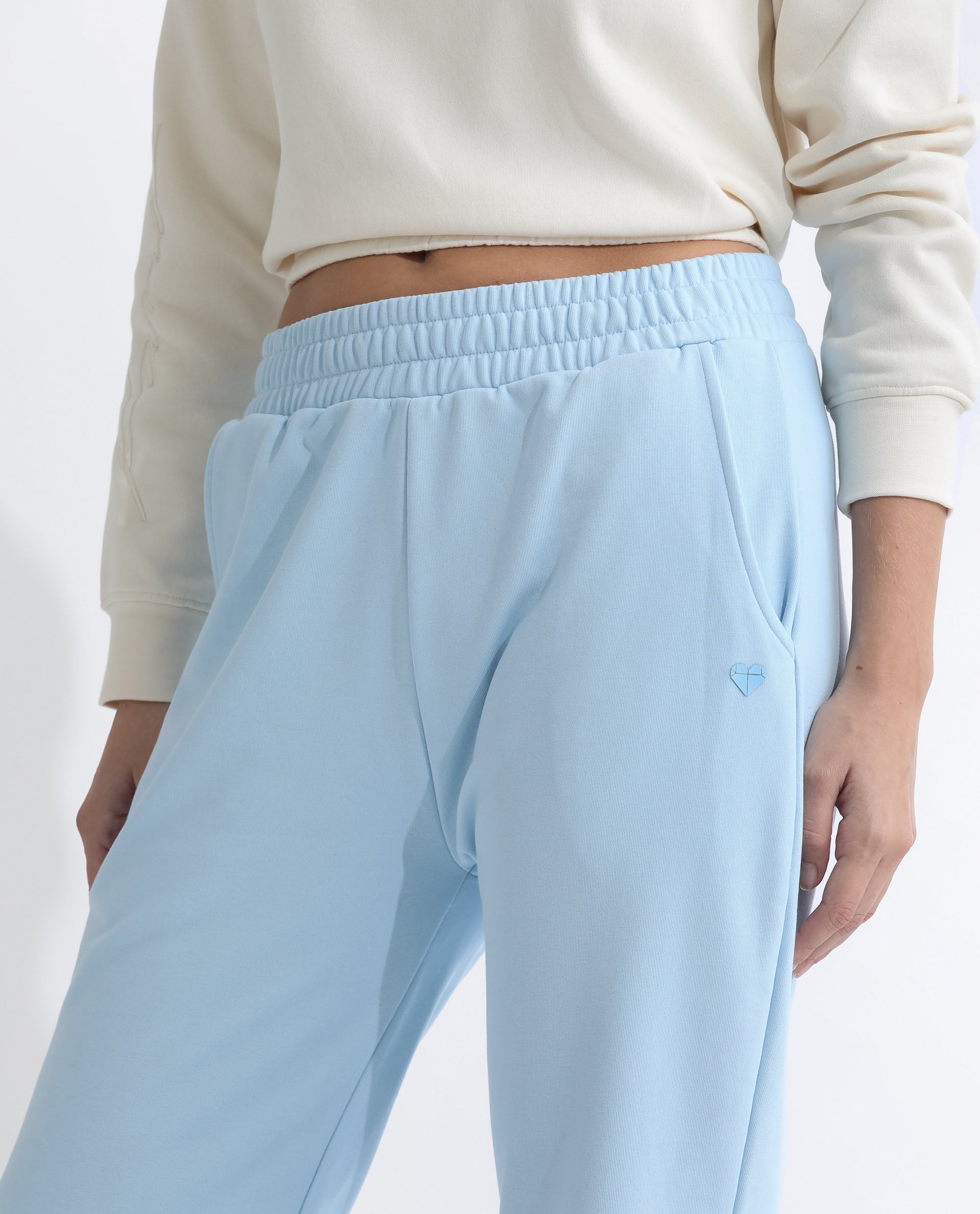 Rareism Women Fronk Light Blue Poly Cotton Fabric Tailored Fit Solid Mid Rise Ankle Length Track Pant