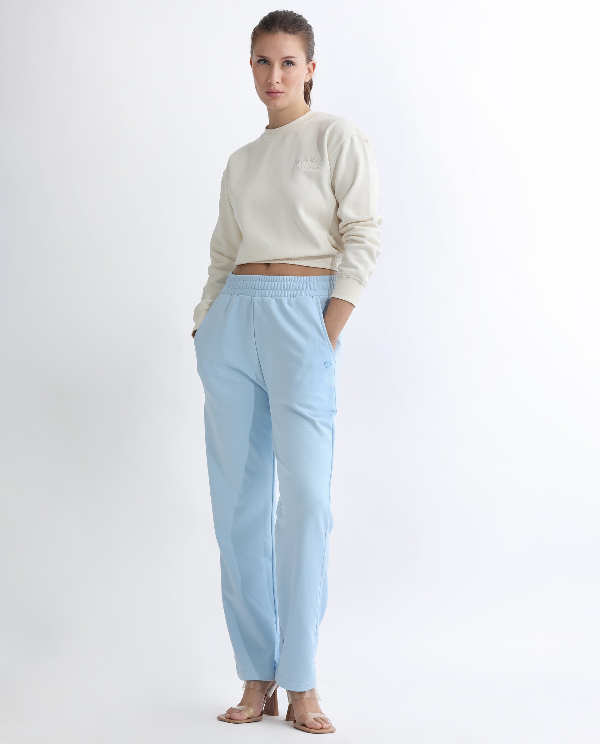 Rareism Women Fronk Light Blue Poly Cotton Fabric Tailored Fit Solid Mid Rise Ankle Length Track Pant