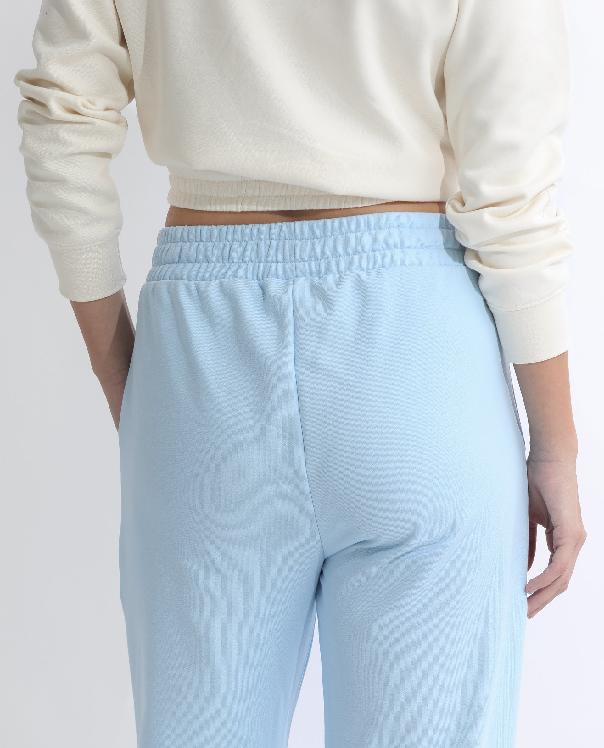 Rareism Women Fronk Light Blue Poly Cotton Fabric Tailored Fit Solid Mid Rise Ankle Length Track Pant