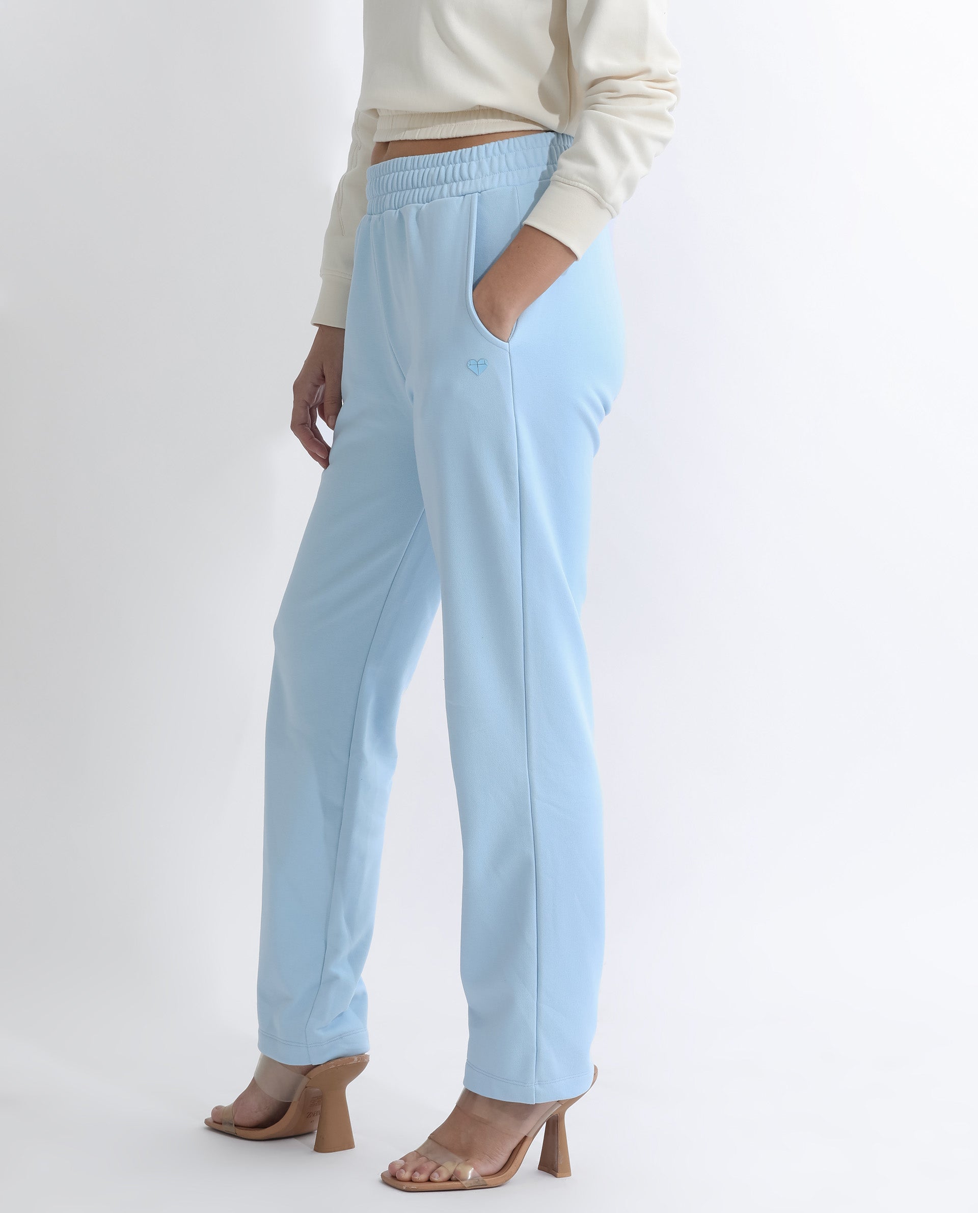 Rareism Women Fronk Light Blue Poly Cotton Fabric Tailored Fit Solid Mid Rise Ankle Length Track Pant