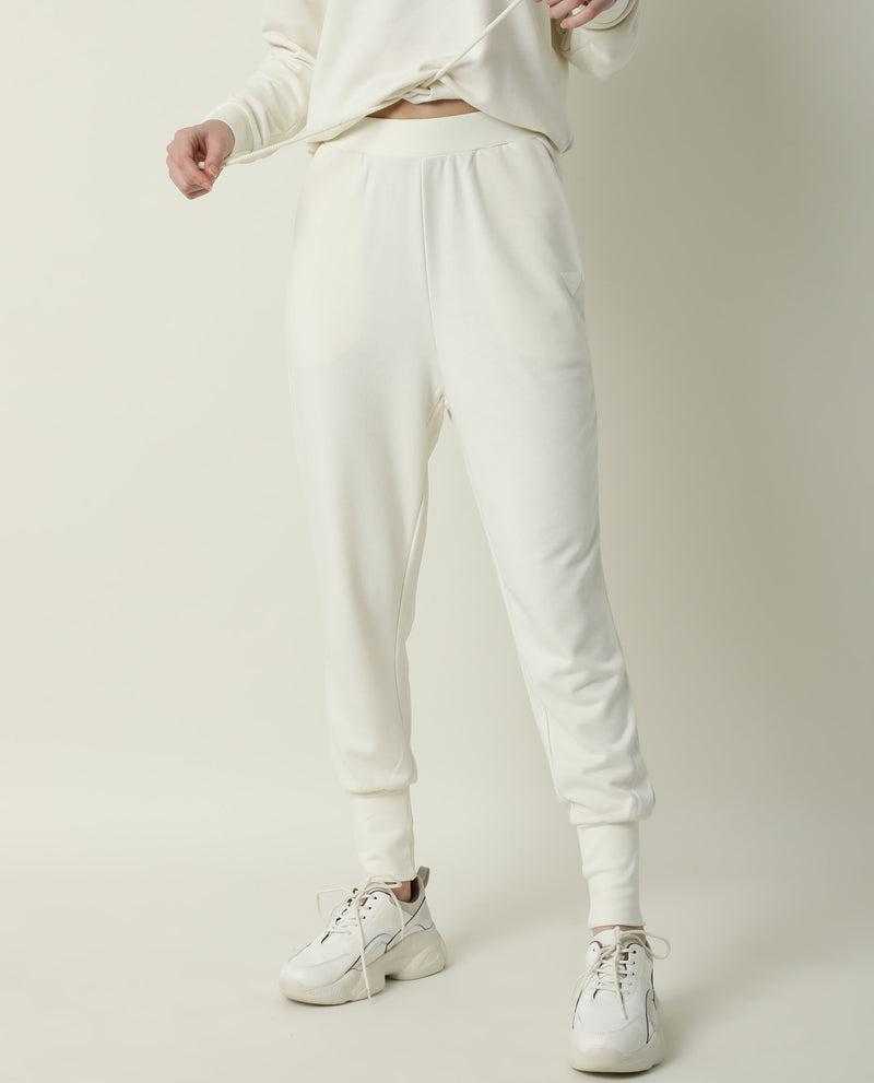 Rareism Women Simp-1 Off White Poly Cotton Fabric Tailored Fit Solid Mid Rise Ankle Length Track Pant