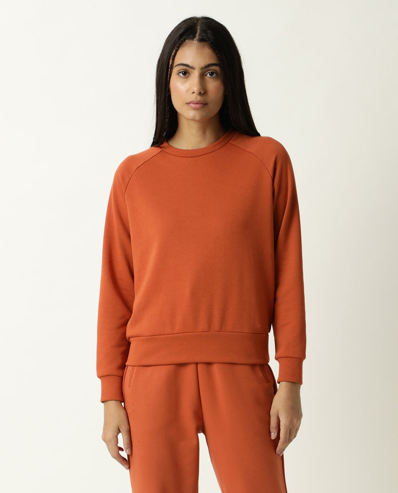 Rareism Women Cax Orange Cotton Blend Fabric Relaxed Fit Full Sleeves Solid Round Neck Sweatshirt