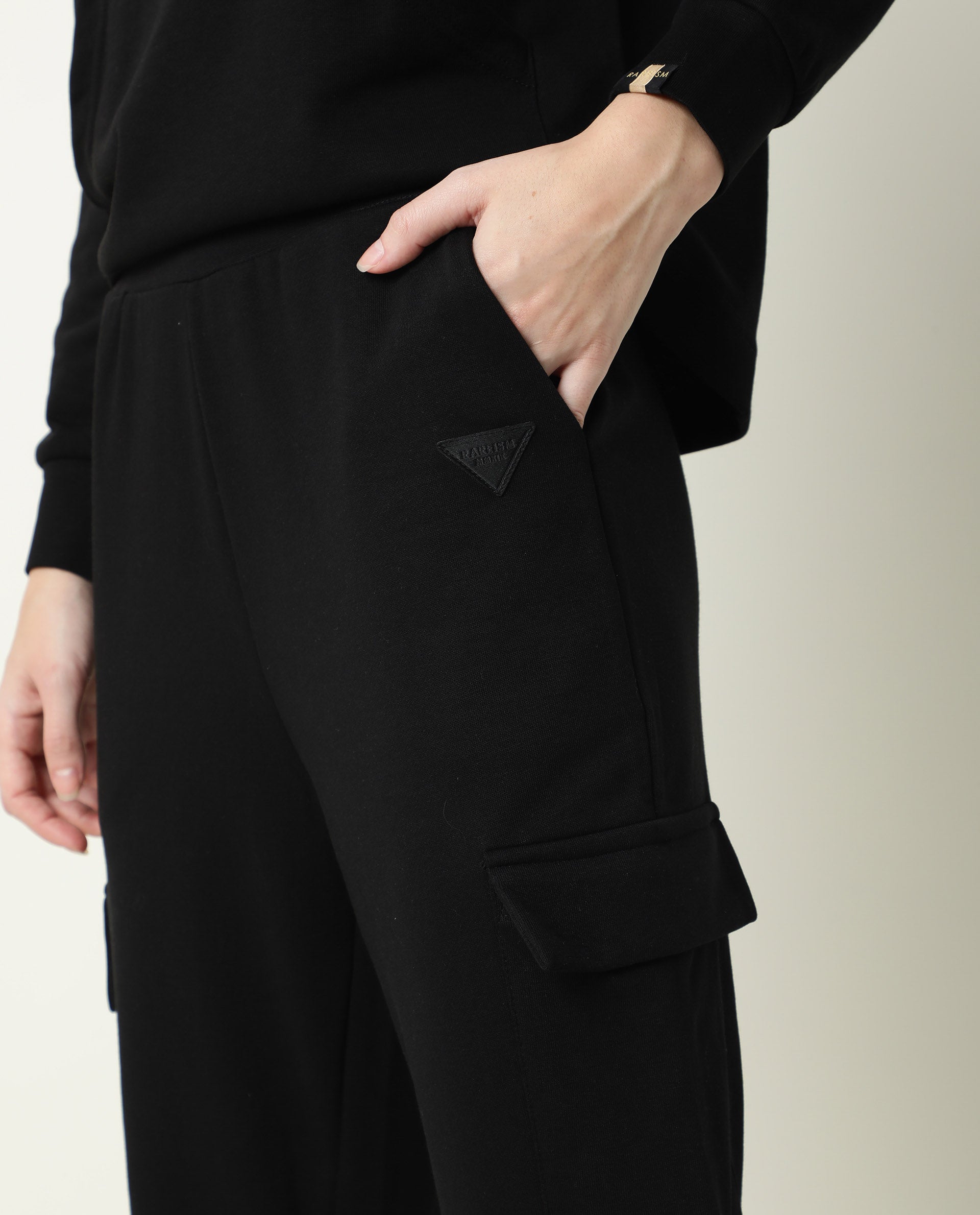 Rareism Women Nush-1 Black Cotton Poly Fabric Tailored Fit Solid Mid Rise Ankle Length Track Pant