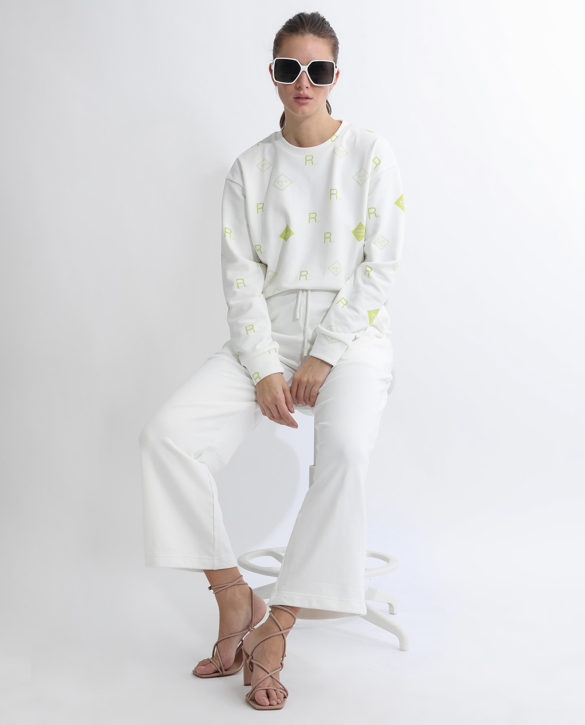 Rareism Women Pazoo T Off White Cotton Blend Fabric Flared Solid Mid Rise Ankle Length Track Pant