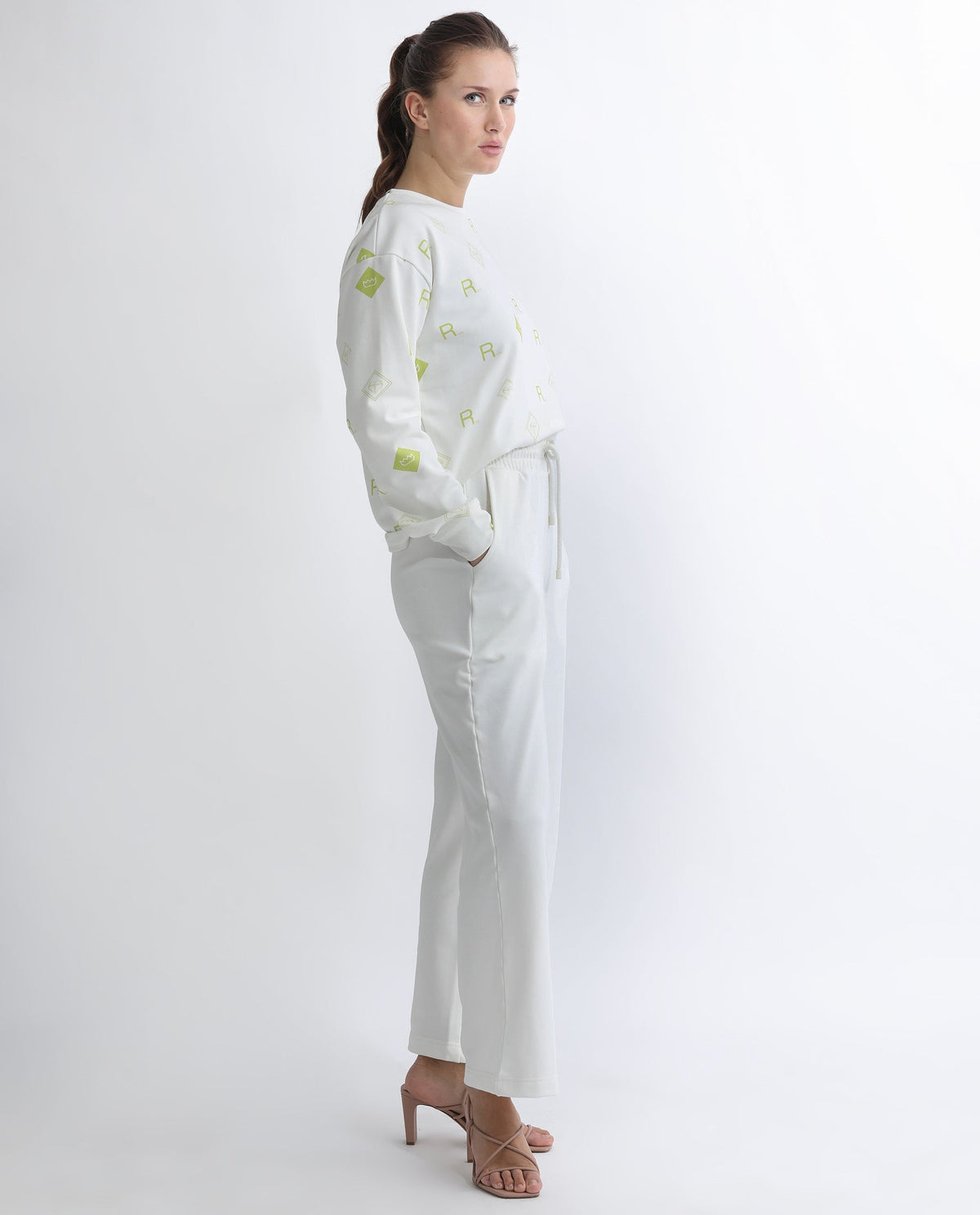 Rareism Women Pazoo T Off White Cotton Blend Fabric Flared Solid Mid Rise Ankle Length Track Pant