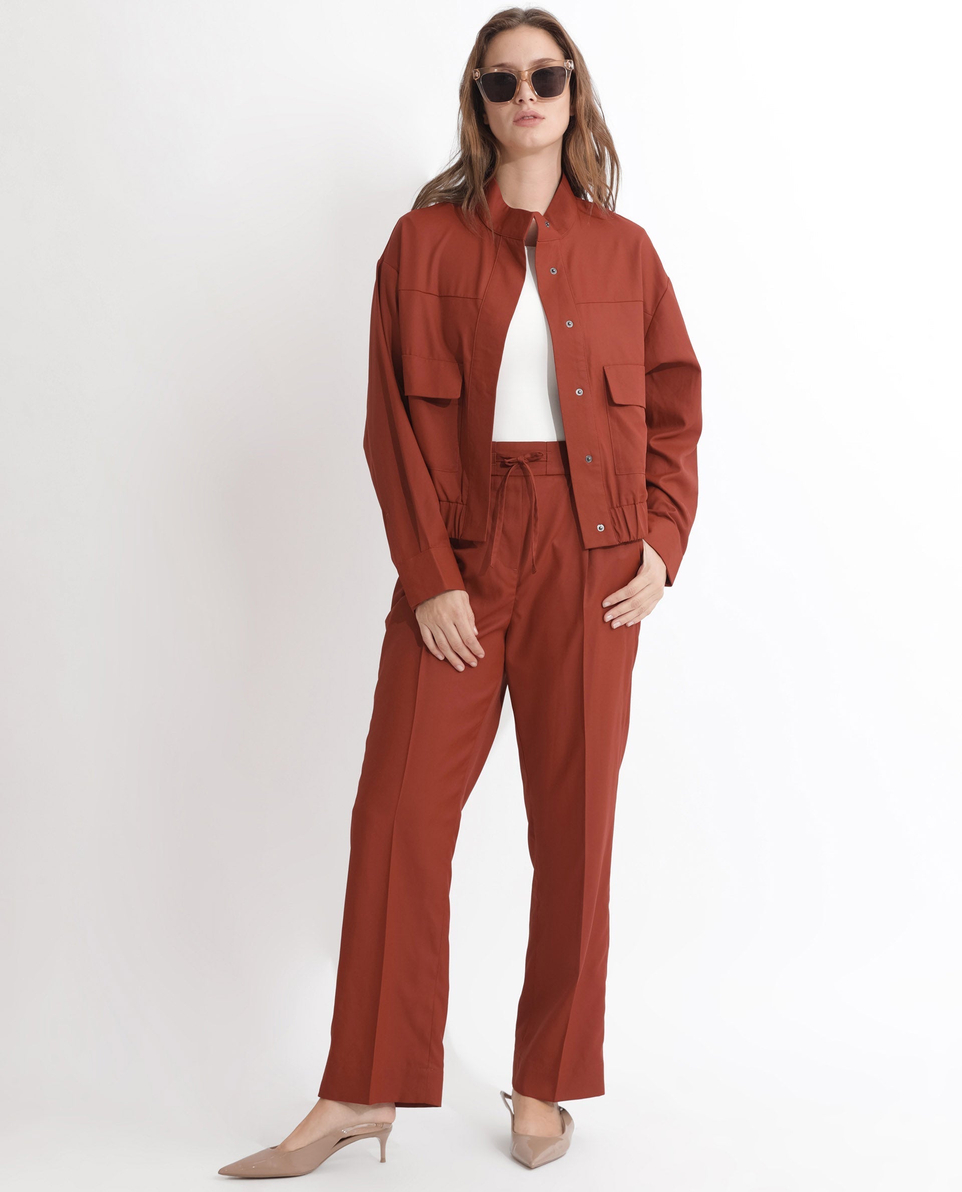 Rareism Articale Women Ruks Rust Polyester Fabric Full Sleeves Button Closure High Neck Regular Fit Plain Jacket
