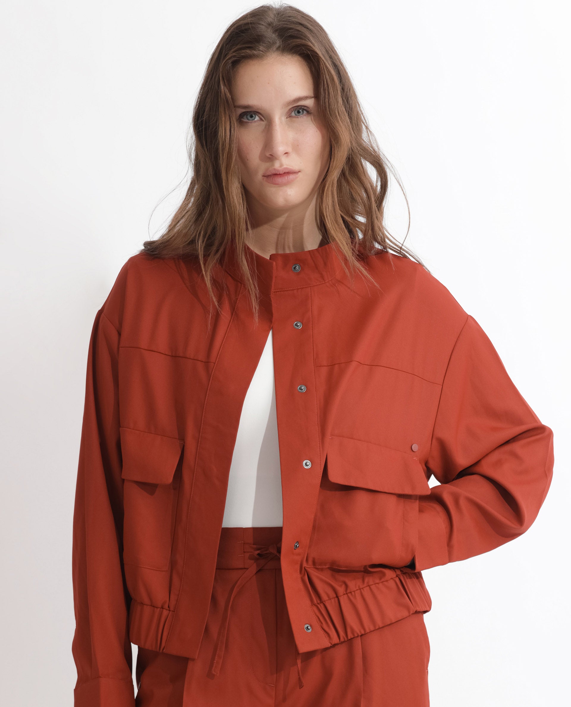 Rareism Articale Women Ruks Rust Polyester Fabric Full Sleeves Button Closure High Neck Regular Fit Plain Jacket