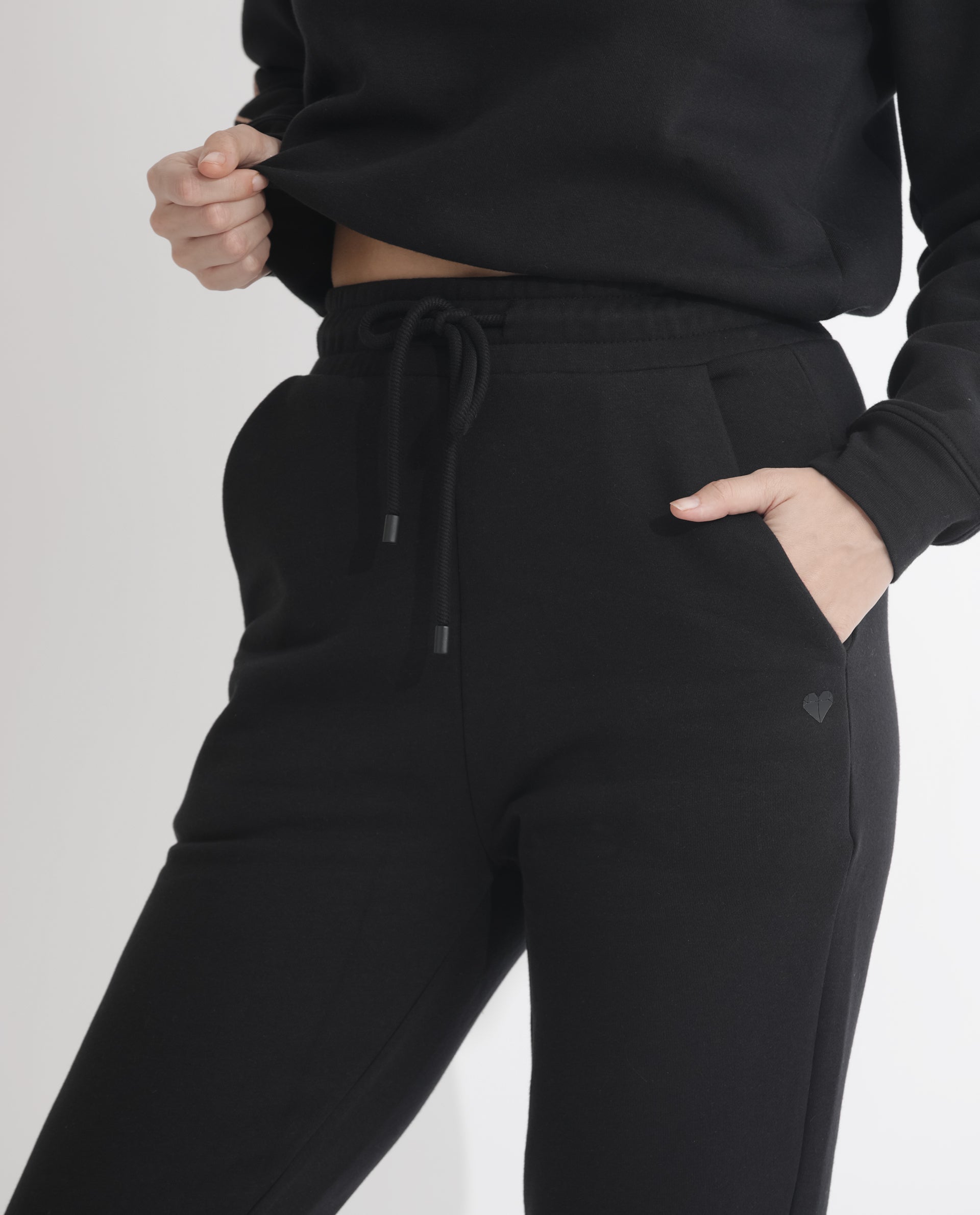 Rareism Women Terac F Black Poly Cotton Fabric Regular Fit Solid Mid Rise Ankle Length Track Pant